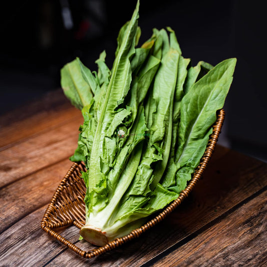 au mak or you mai cai or baby romaine lettuce on a wooden basket