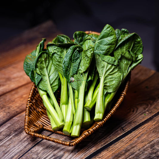 Hong Kong chye sim or choi sum with long stems and dark green leaves.