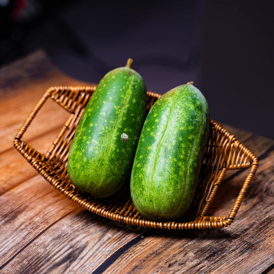 Two green merrow on basket, on wood - a Caribbean sea vegetable, with wavy edges and succulent texture