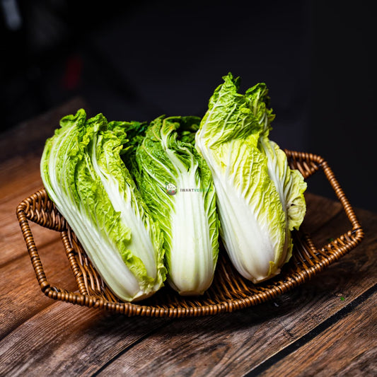 Wawa Cai laid on basket and wood surface. A leafy green vegetable commonly used in Asian cuisine