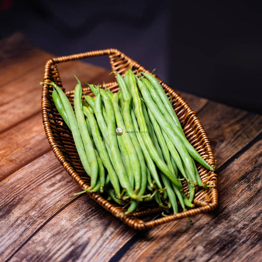 Fresh French beans in basket on wooden surface. Green, slender and vibrant. A nutritious vegetable